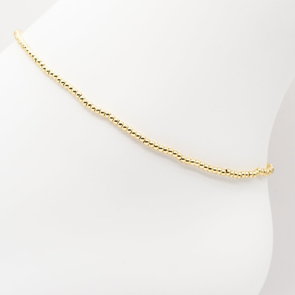 Gold necklace on a white background