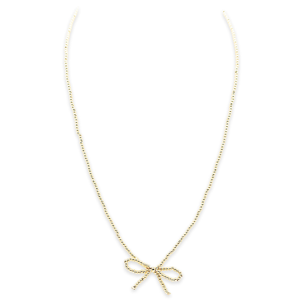 Gold bow-shaped necklace on a white background