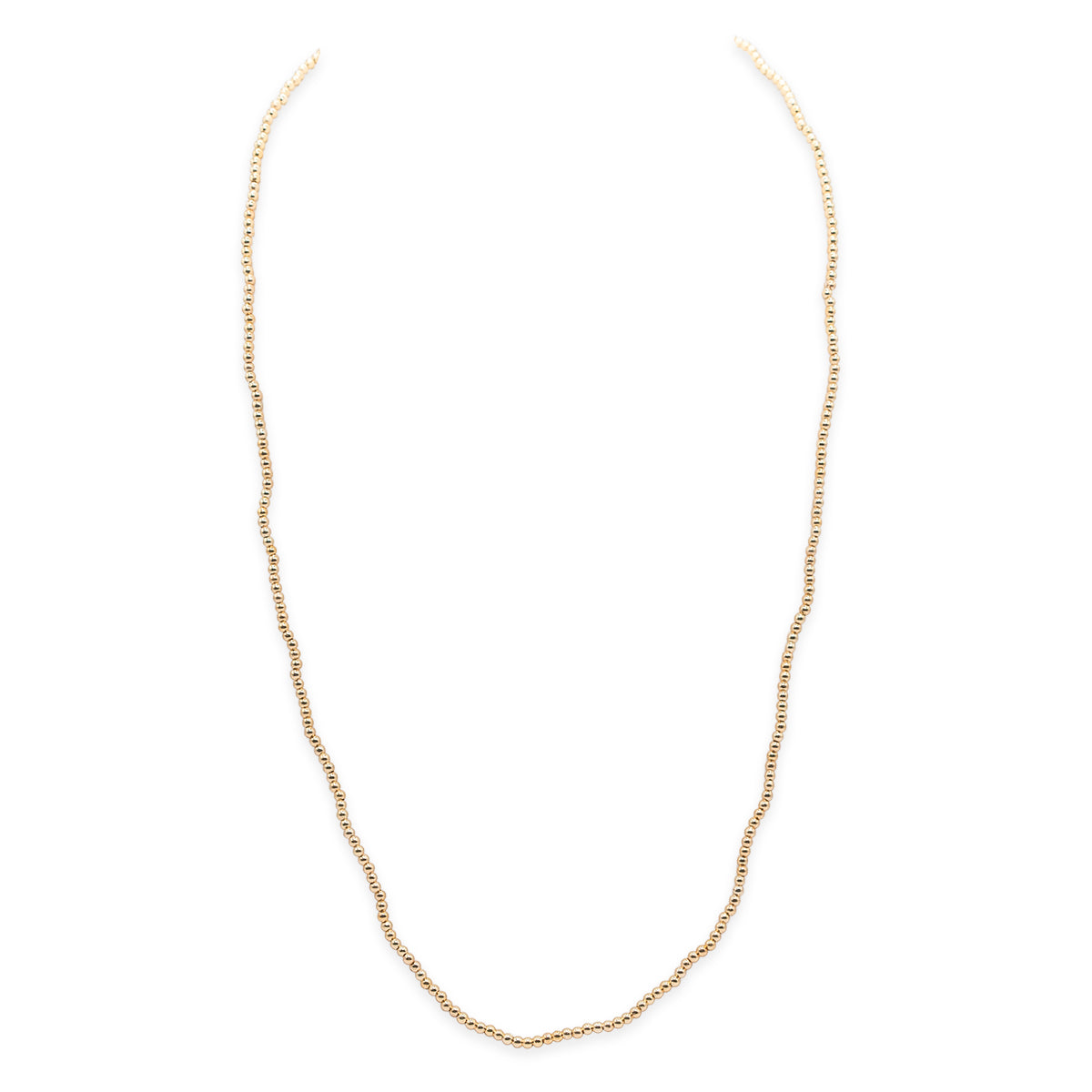 Gold beaded necklace on a white background