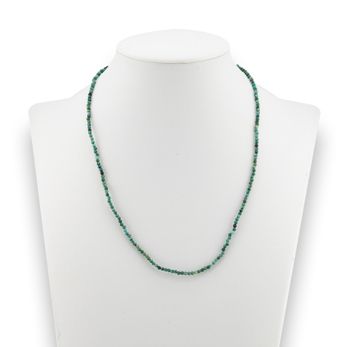 Green beaded necklace on a mannequin bust against a white background