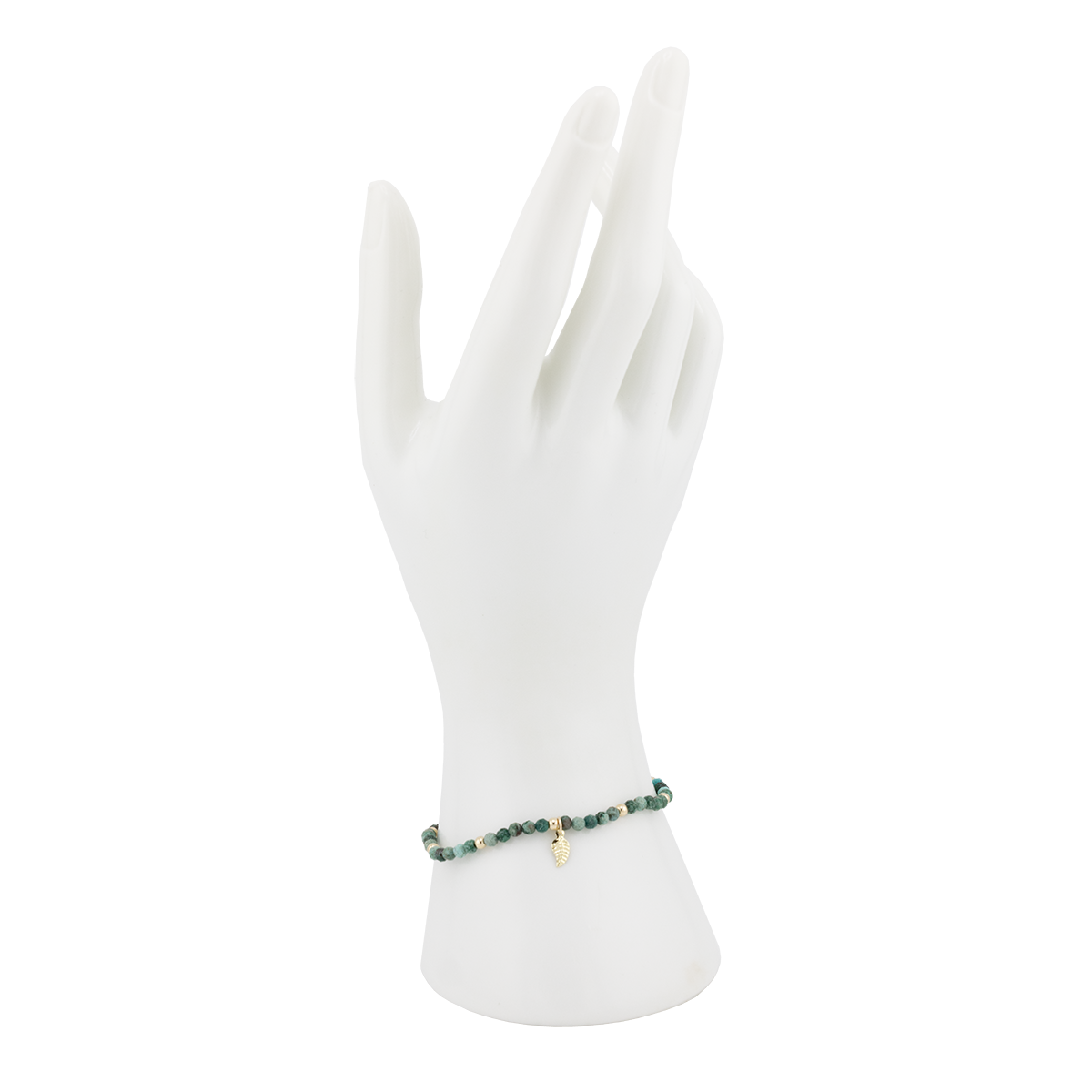 Green beaded bracelet on a white mannequin hand with a white background