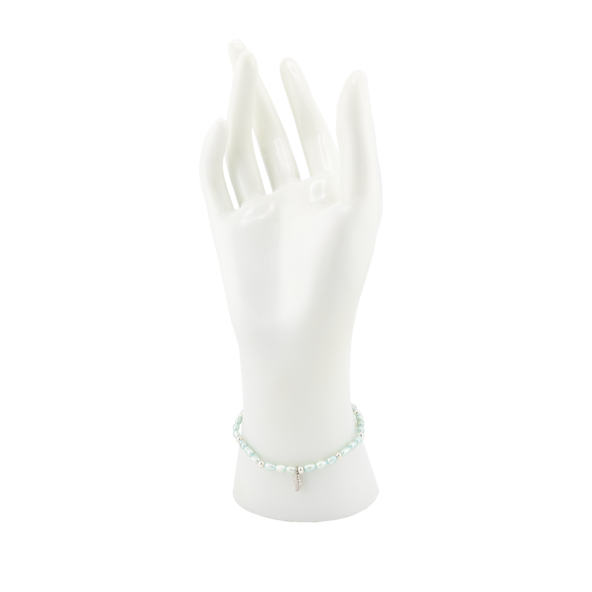 White ceramic hand holding a green bracelet on a white background