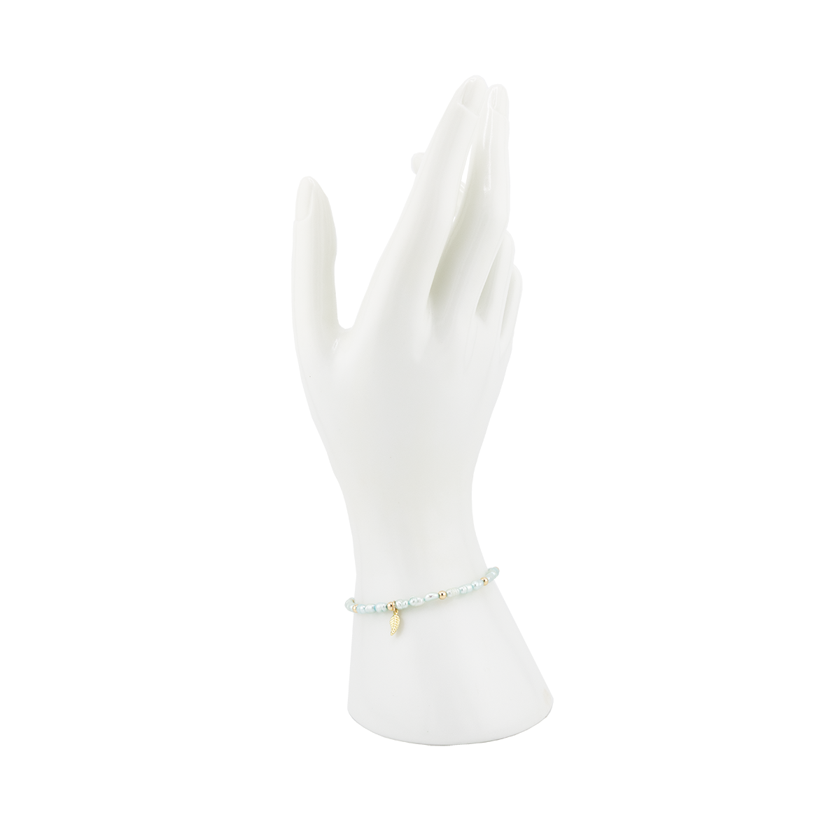 White mannequin hand wearing a bracelet on a white background