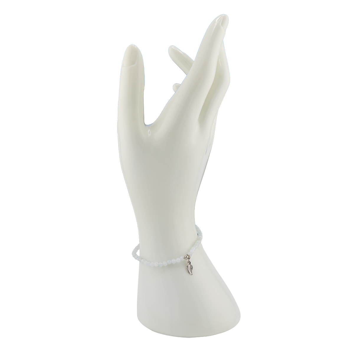 White bracelet on a white mannequin hand against a white background