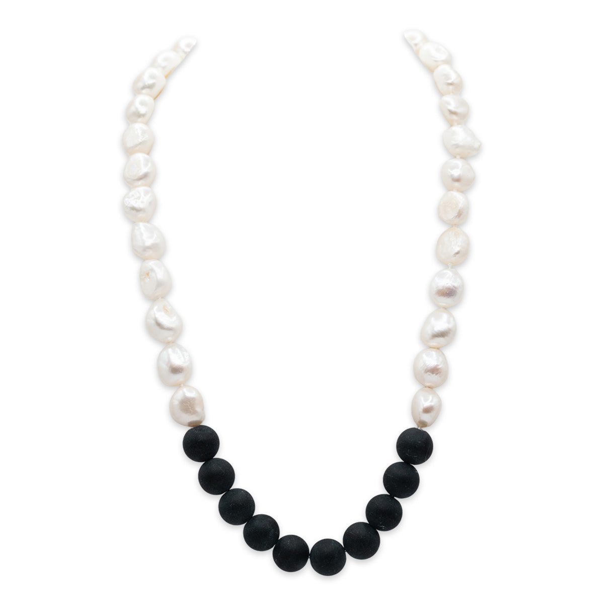 Necklace with alternating white pearls and black beads on a white background