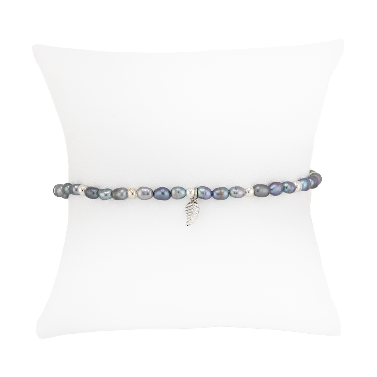 Pearl bracelet on a white mannequin with a white background