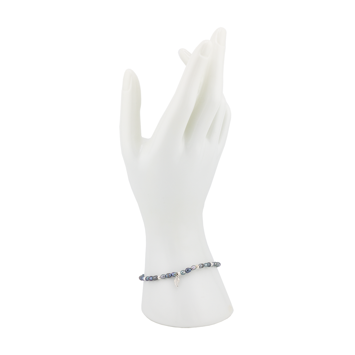Bracelet on a white mannequin hand with a white background