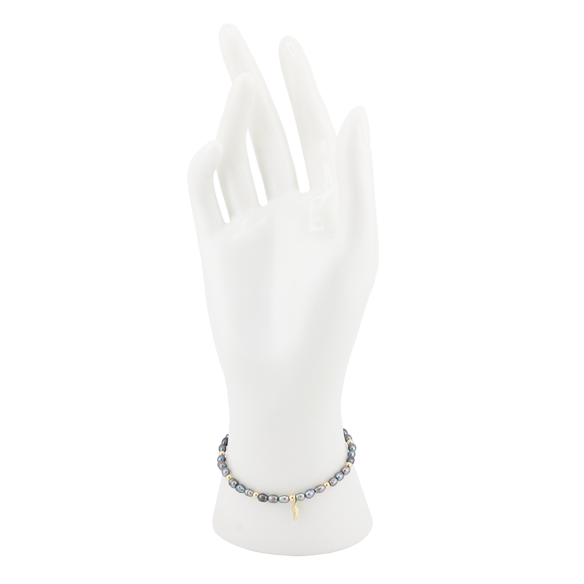 Bracelet on a mannequin hand with a white background