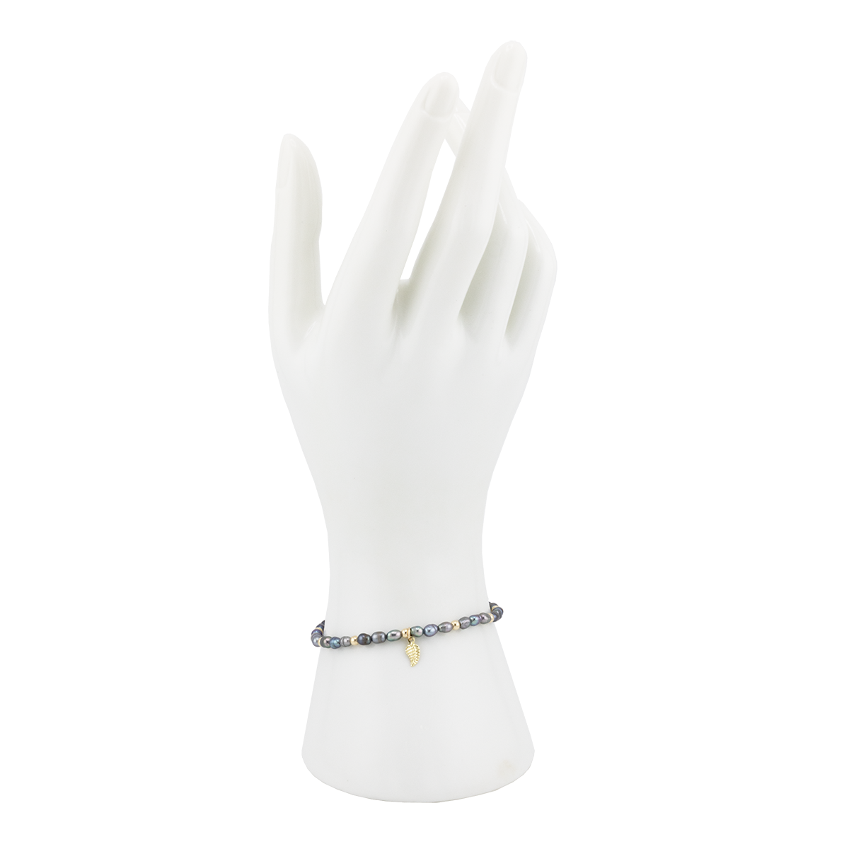 Bracelet on a white mannequin hand with a white background