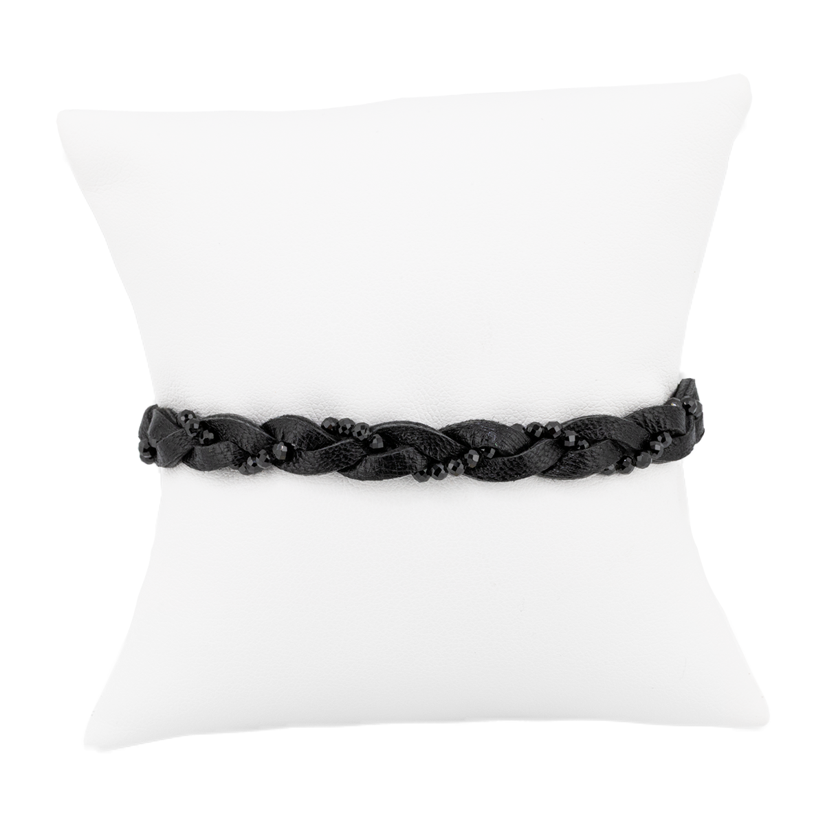 Black braided belt on a white pillow