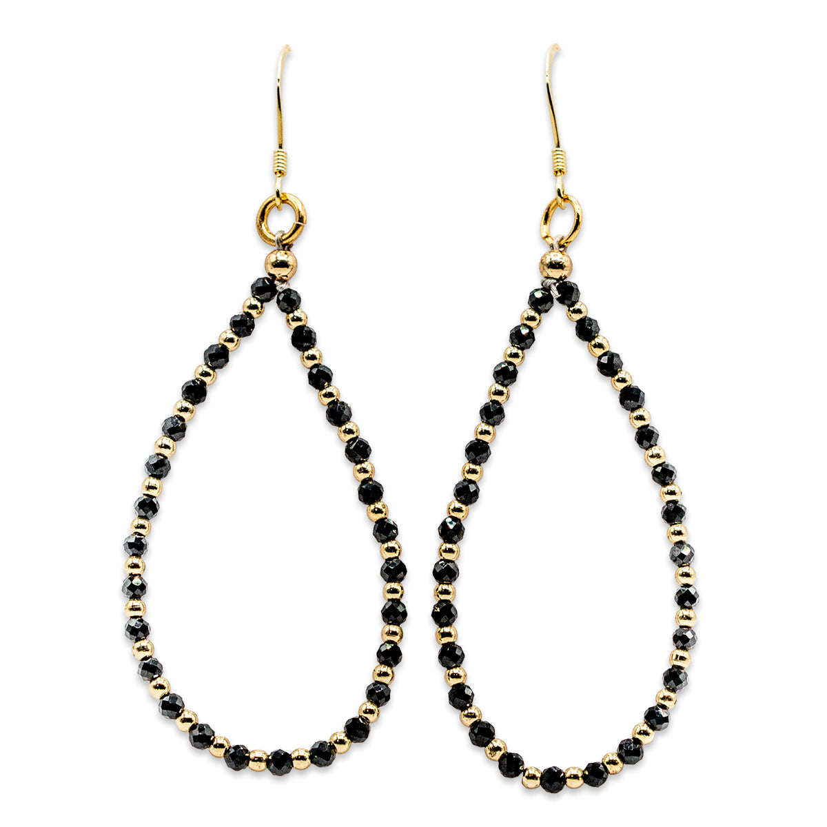 Pair of black beaded earrings with gold accents on a white background