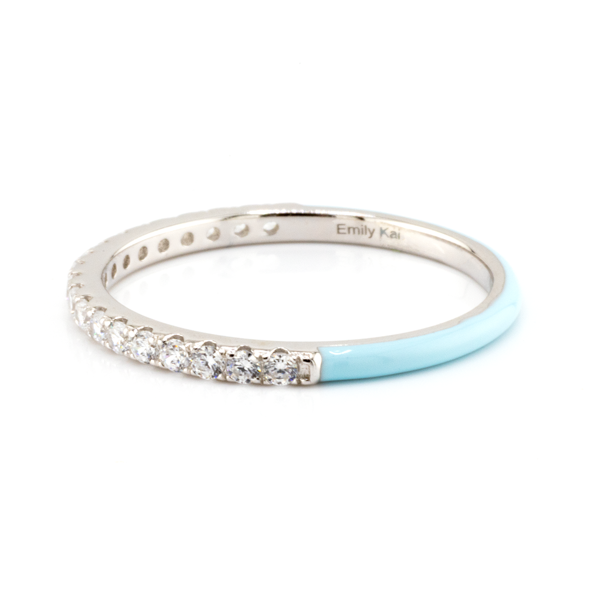 Silver ring with diamonds and a light blue band on a white background