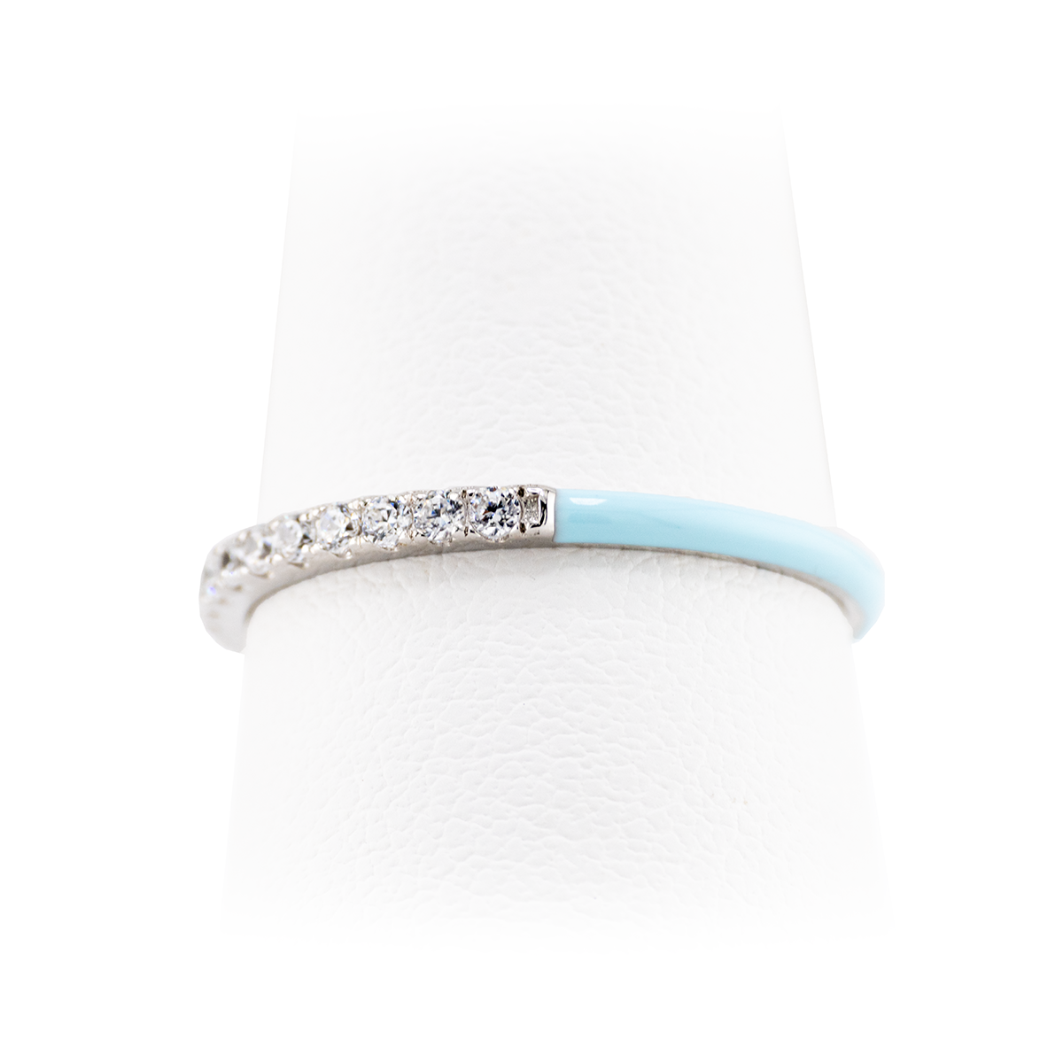Ring with light blue band and diamond accents on a white background
