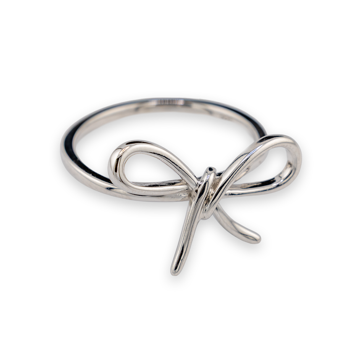 Silver bow-shaped ring on a white background