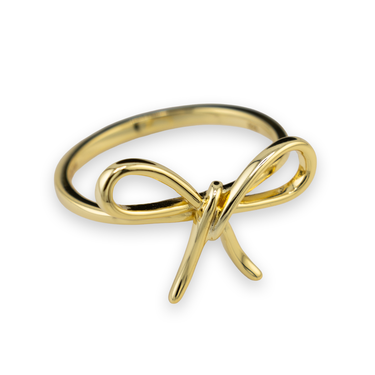 Gold bow-shaped ring on a white background