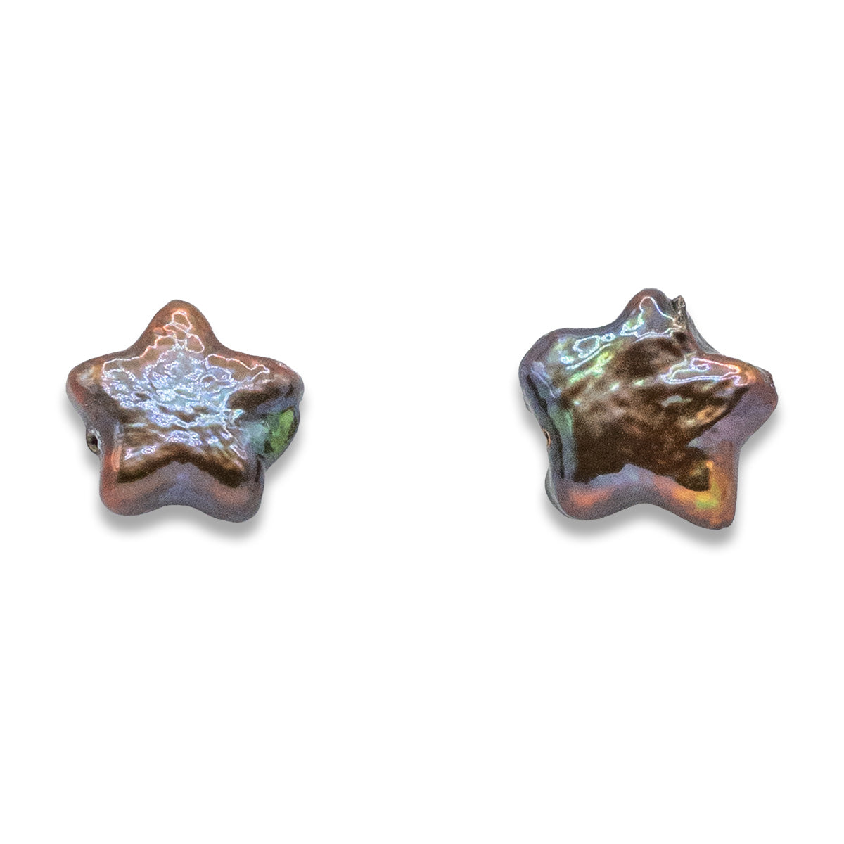 Two star-shaped ceramic beads with metallic sheen on a white background