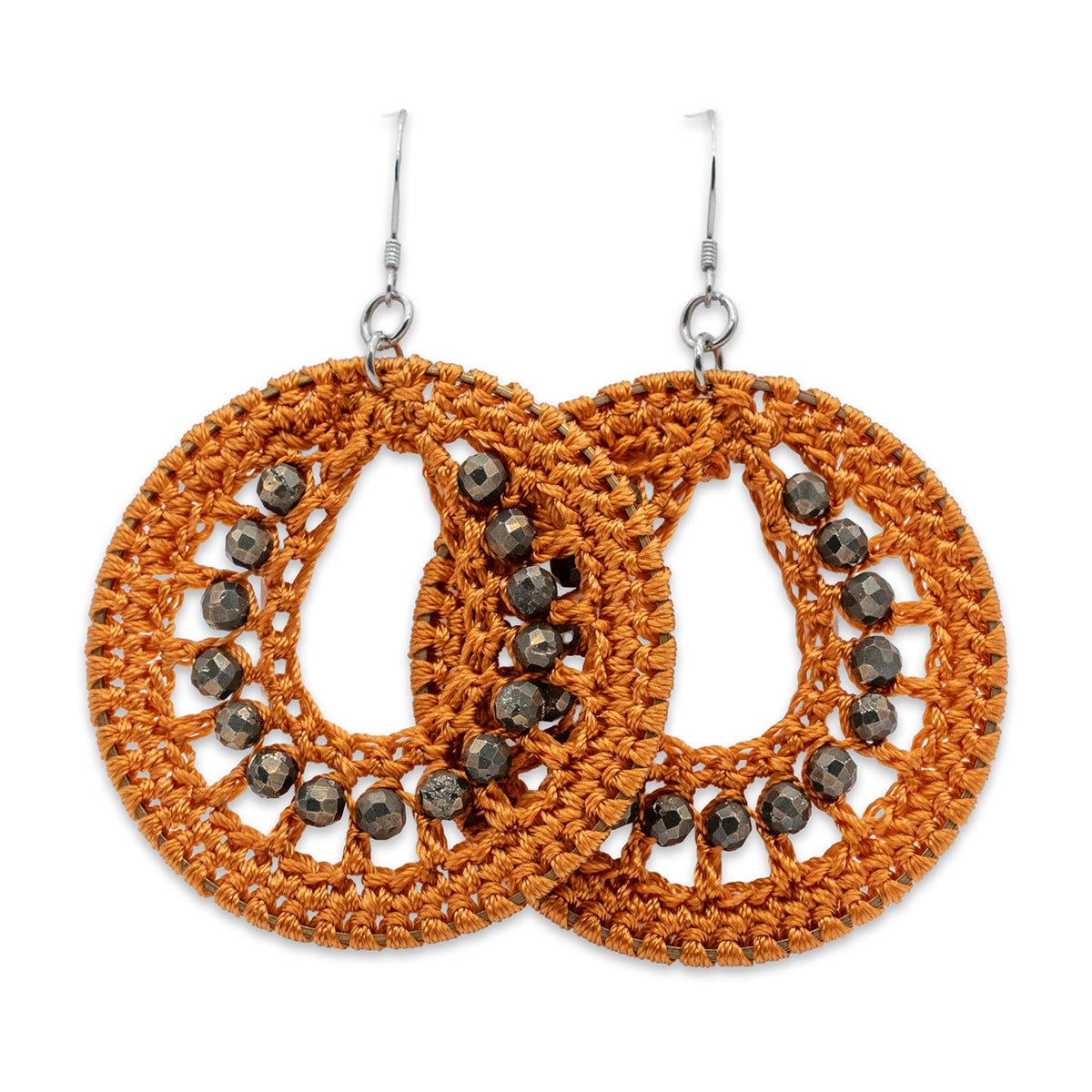 Pair of orange crochet earrings with bead embellishments on a white background