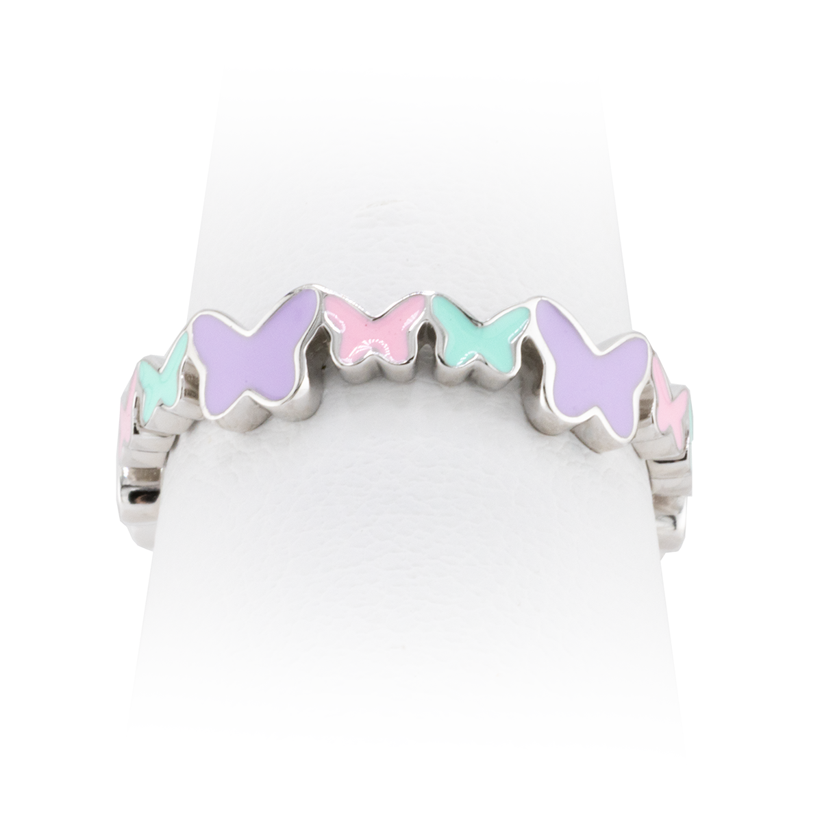 Ring with pastel butterfly-shaped stones on a white background