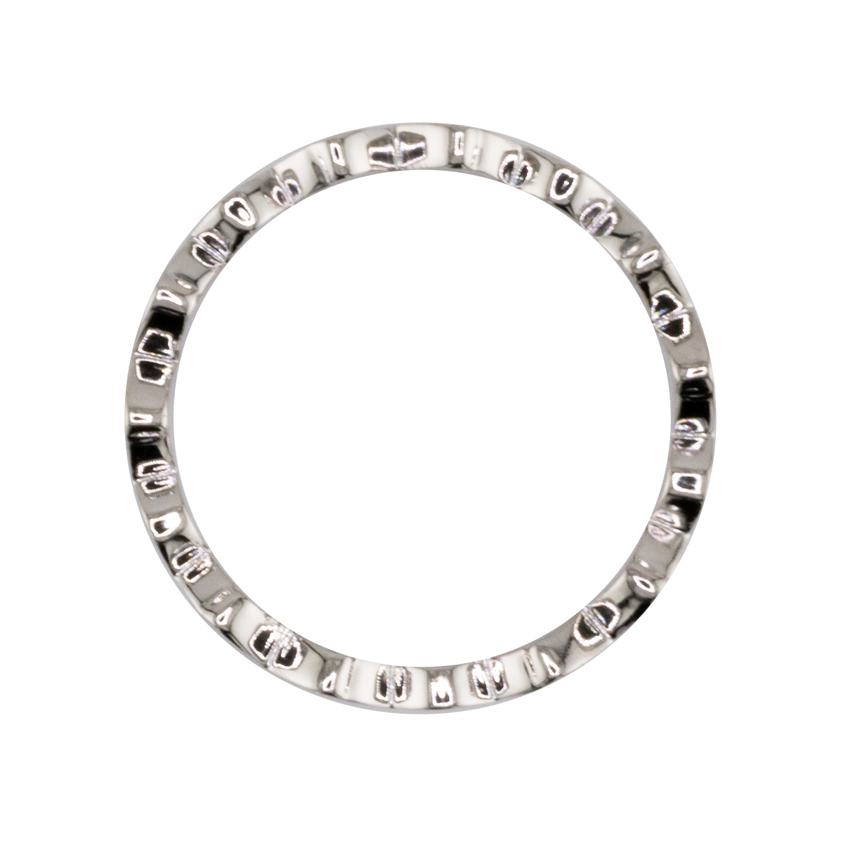 Silver ring with engraved design on a white background