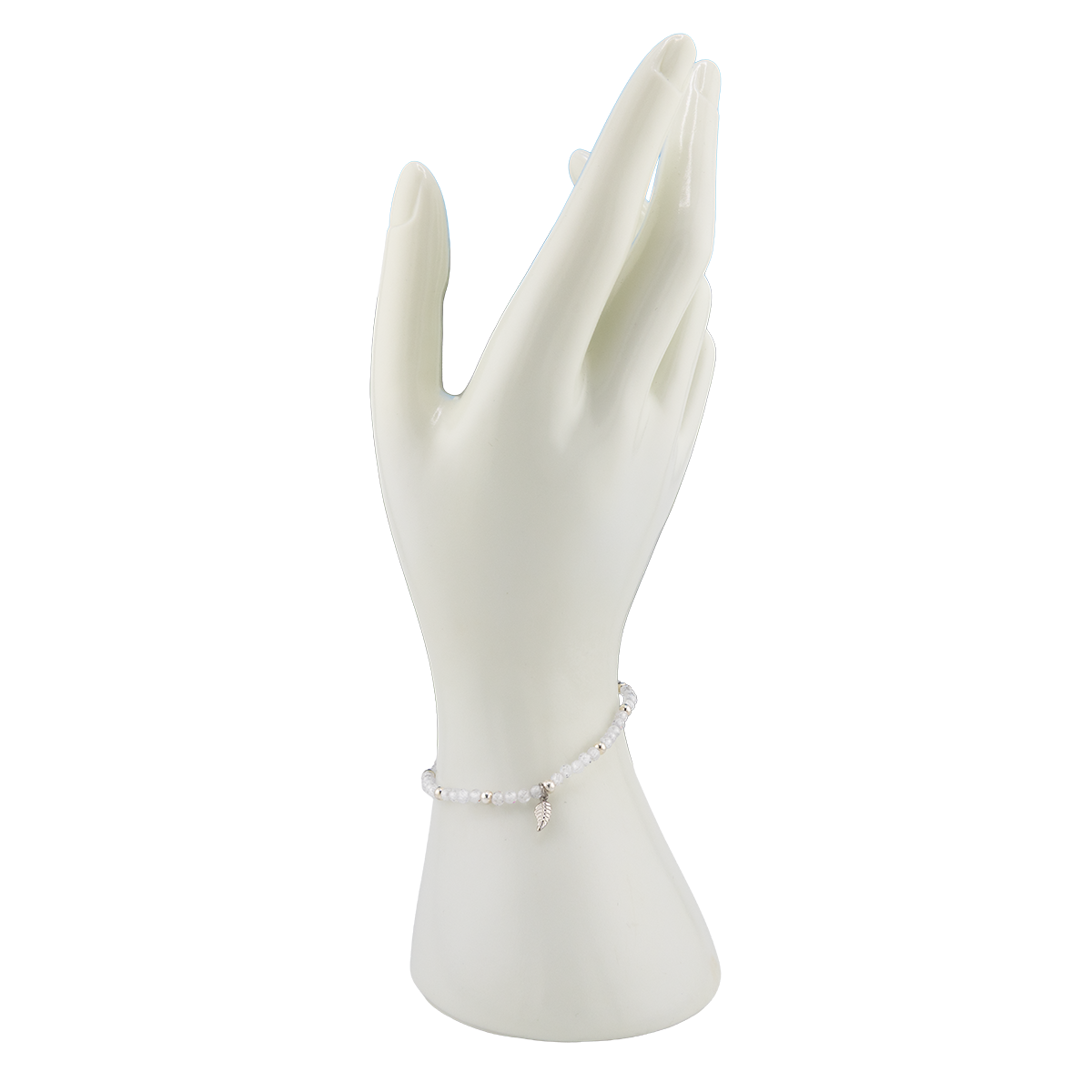 White bracelet on a mannequin hand against a white background