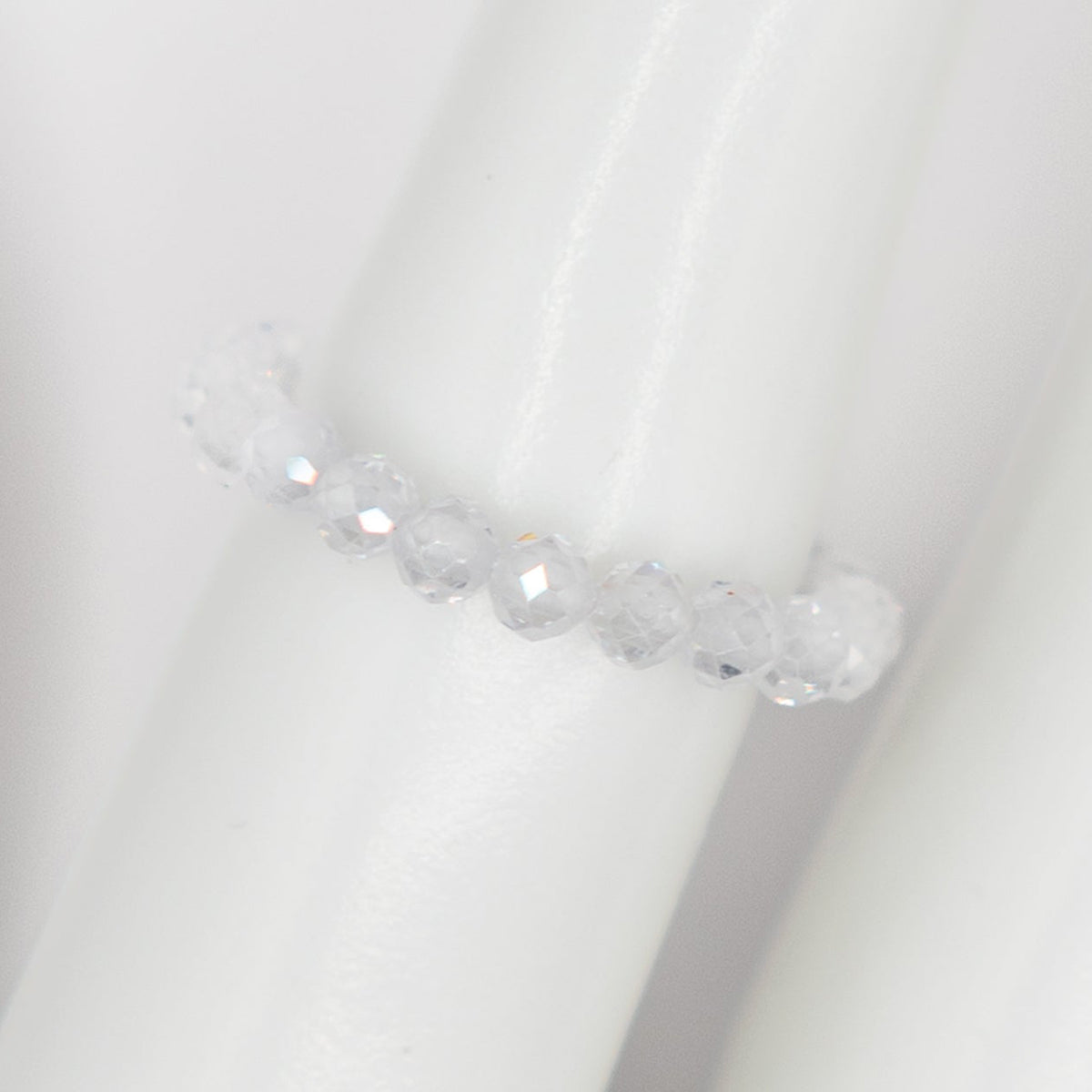Clear crystal ring on a white background