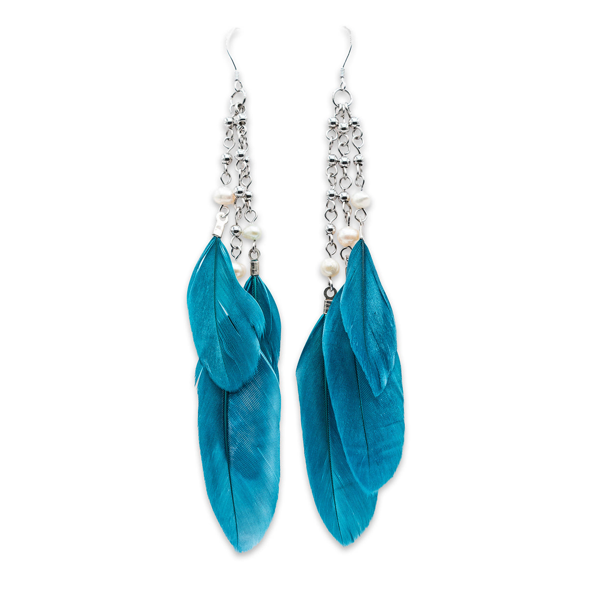 Turquoise feather earrings with silver accents on a white background