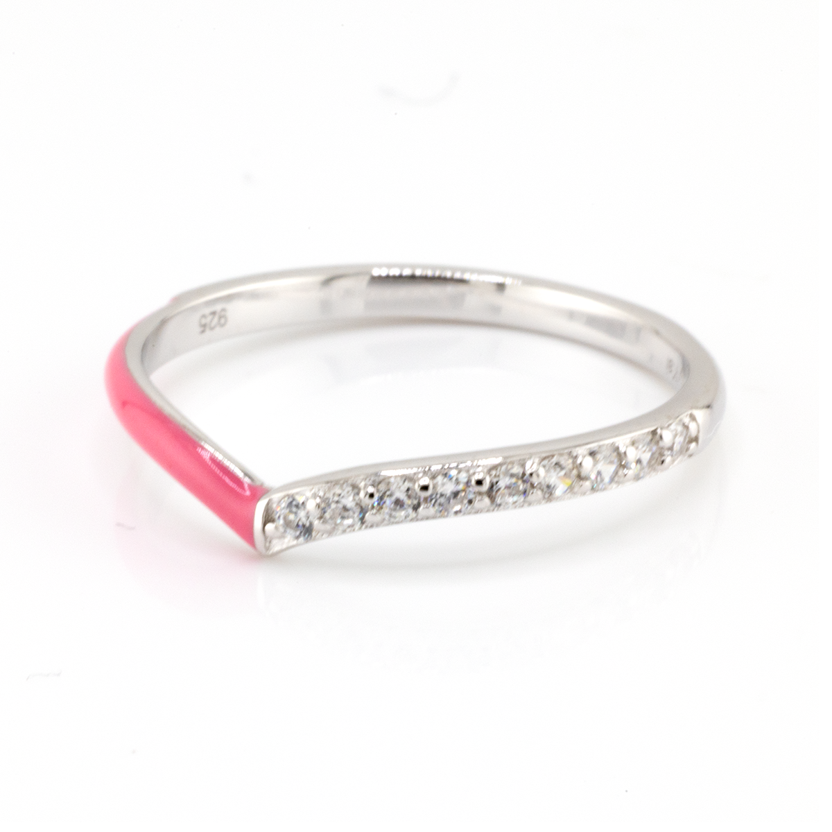 Silver ring with pink enamel and diamond accents on a white background