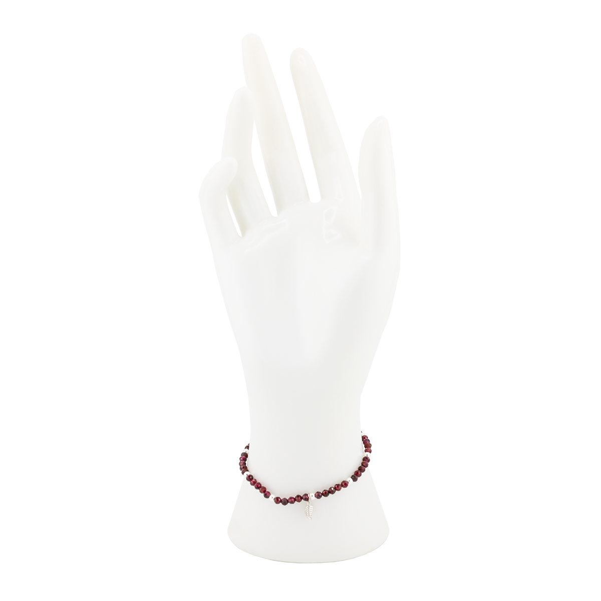 White anklets with red beads on a white background