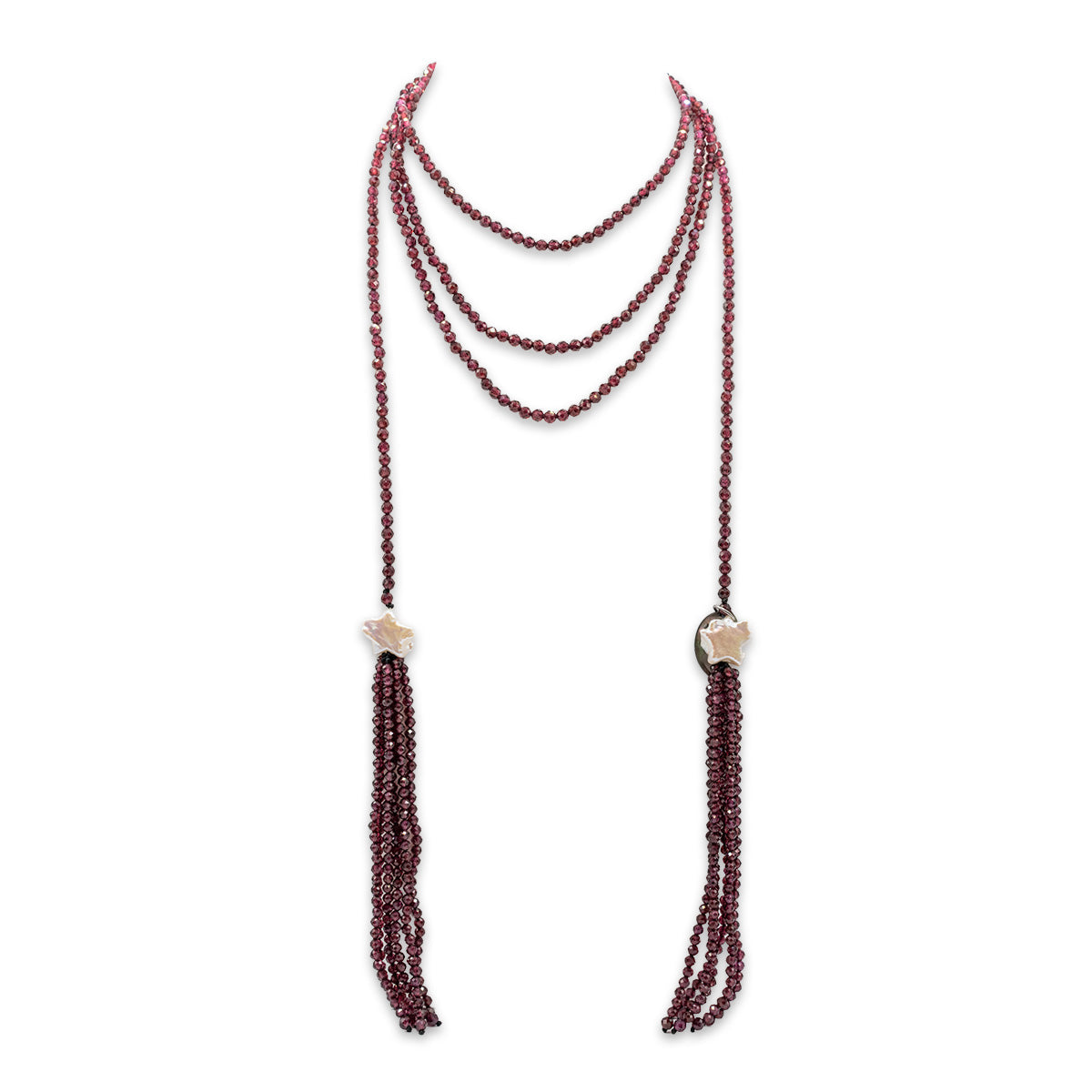Multi-strand beaded necklace with tassels on a white background