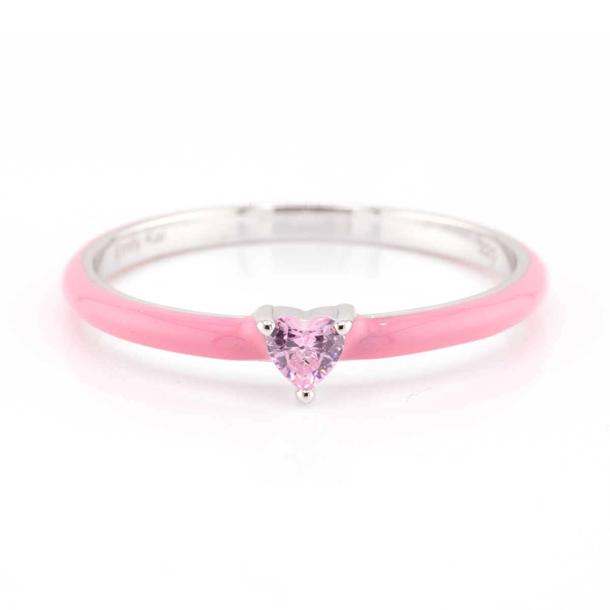 Pink heart-shaped gemstone ring on a white background