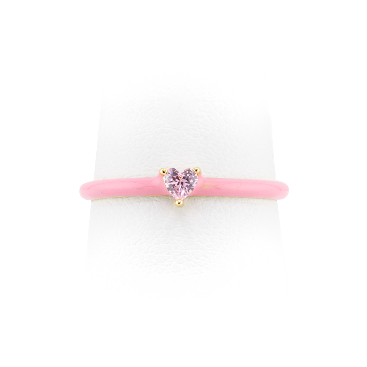 Pink hair tie with a heart-shaped pink gem on a white background