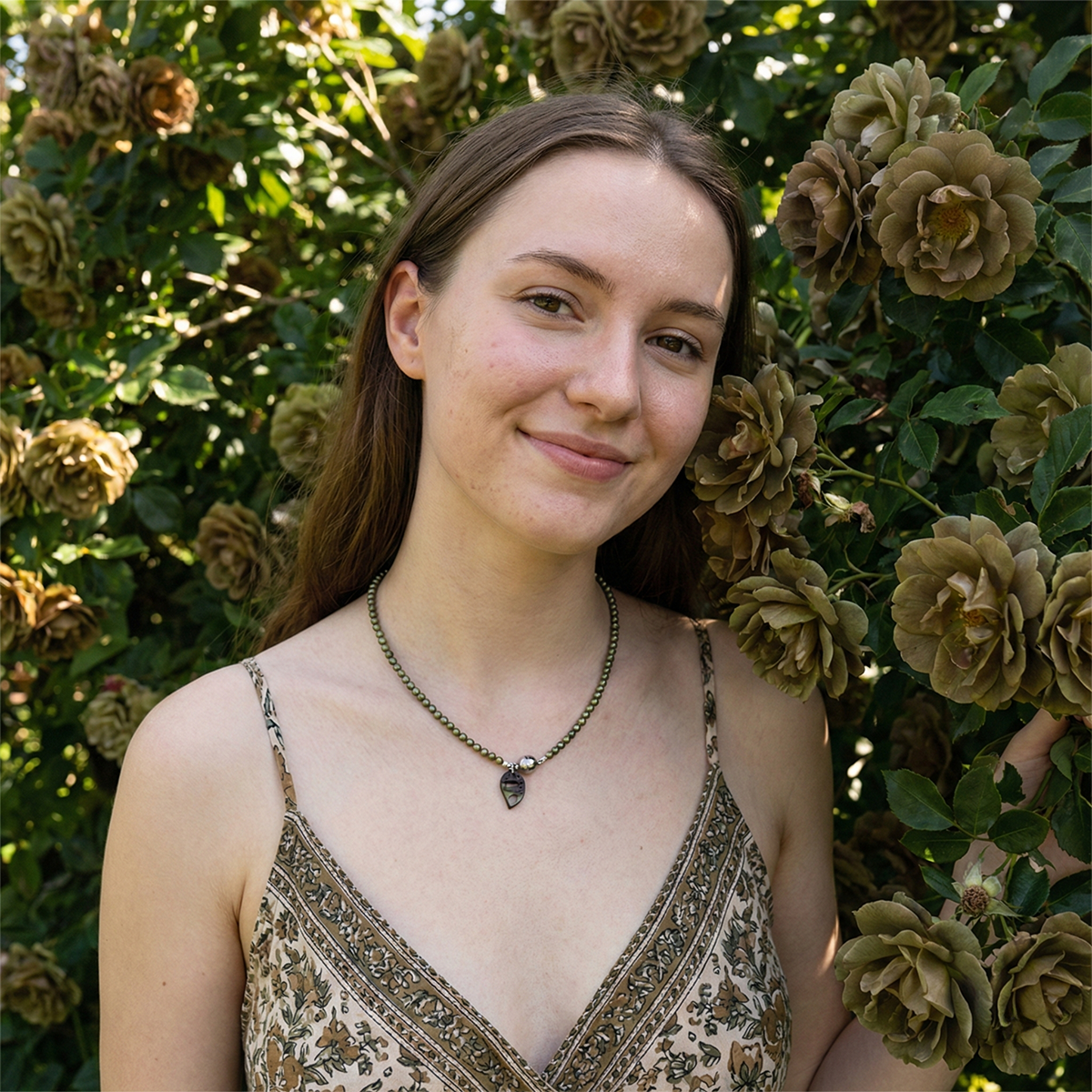 Woman standing in front of a floral background