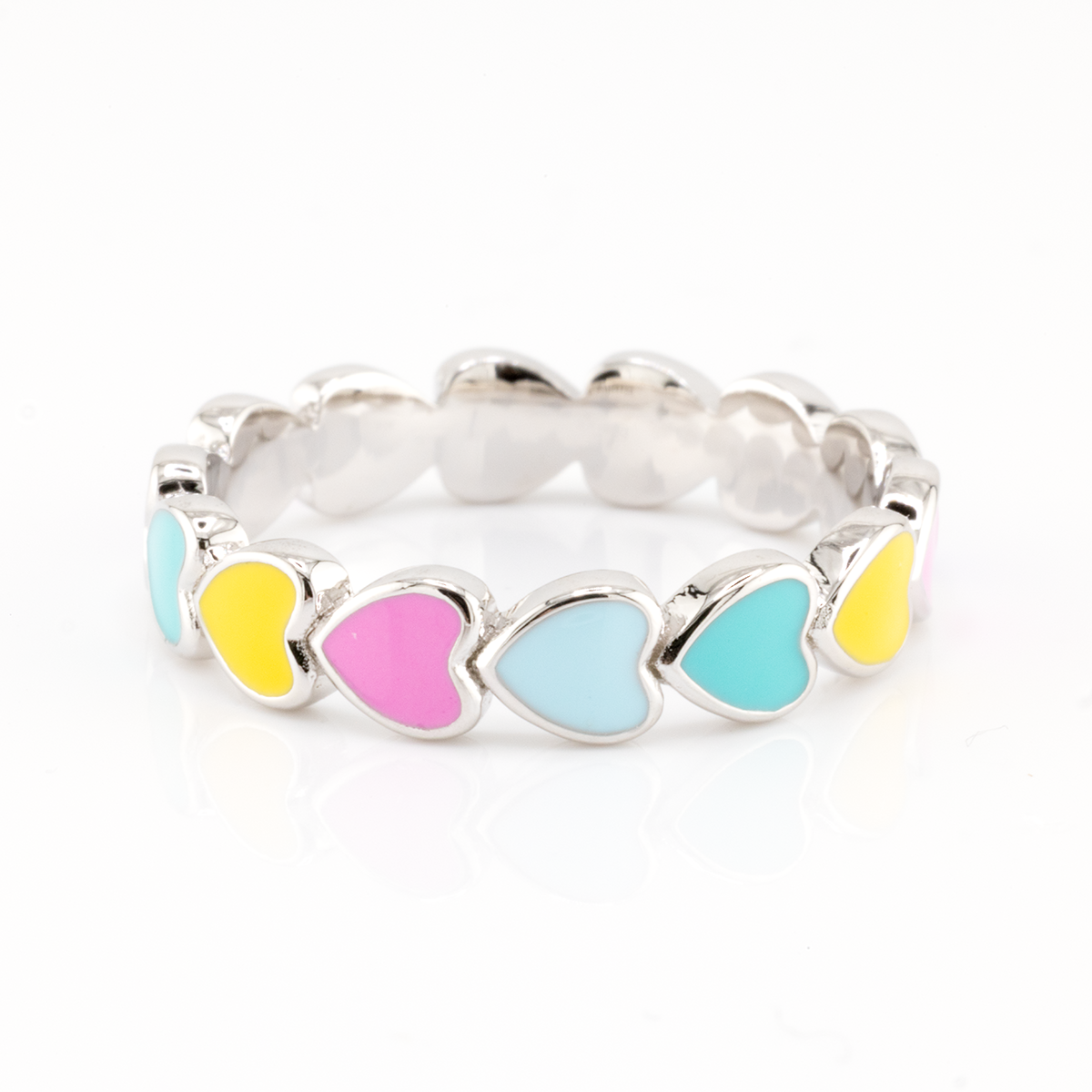 Silver ring with colorful heart-shaped stones on a white background