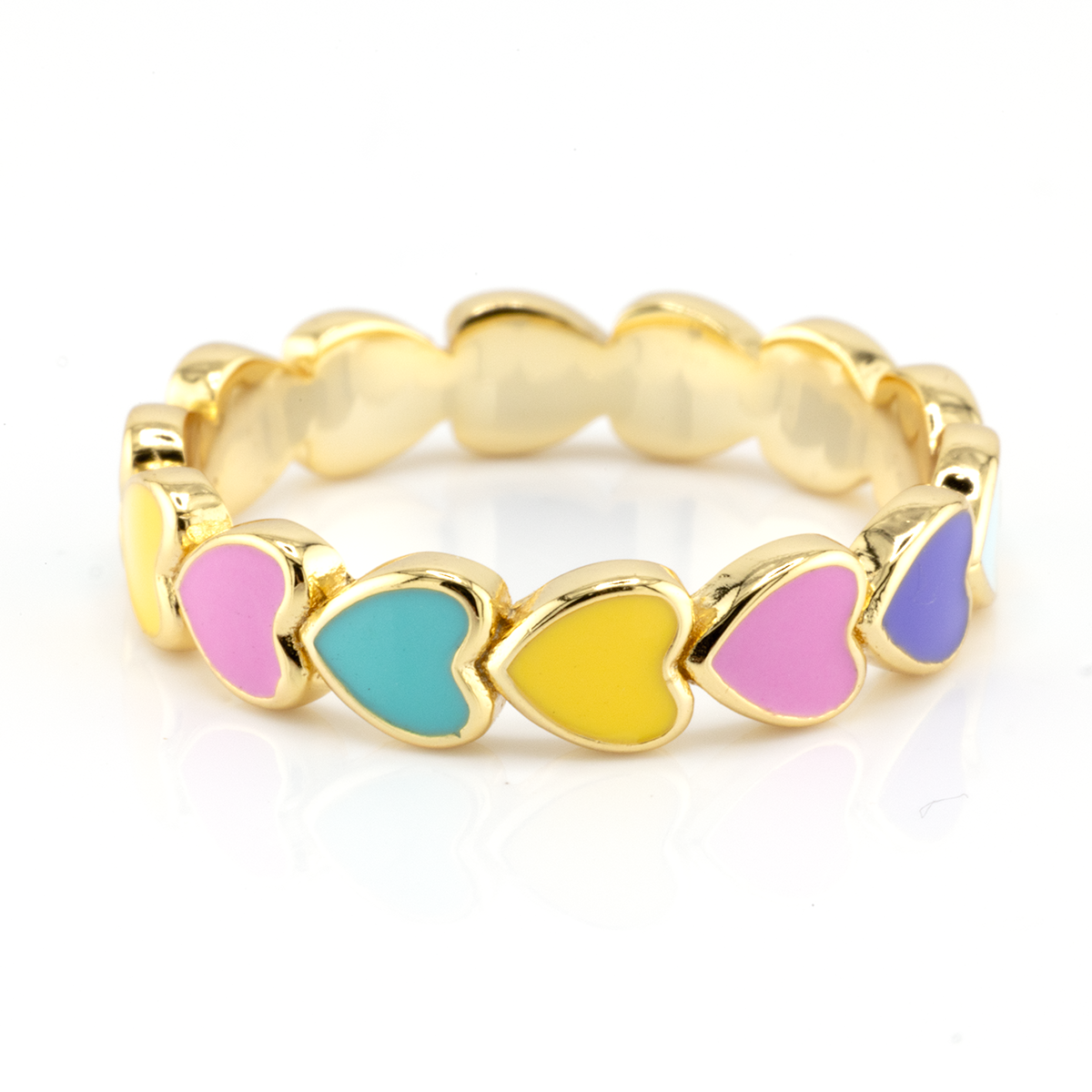 Gold ring with colorful heart-shaped stones on a white background