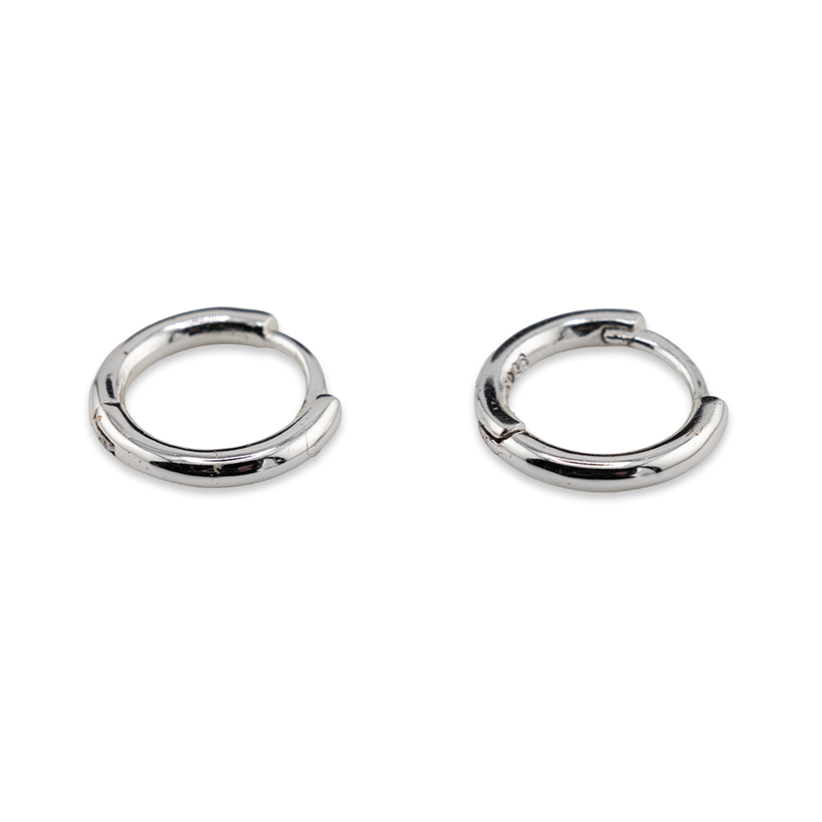 Pair of silver hoop earrings on a white background