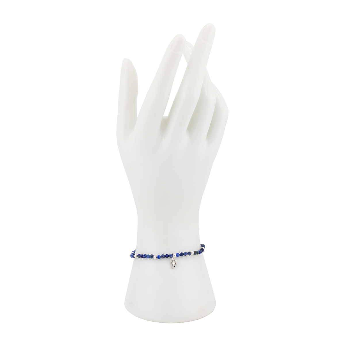 Bracelet on a white mannequin hand with a white background