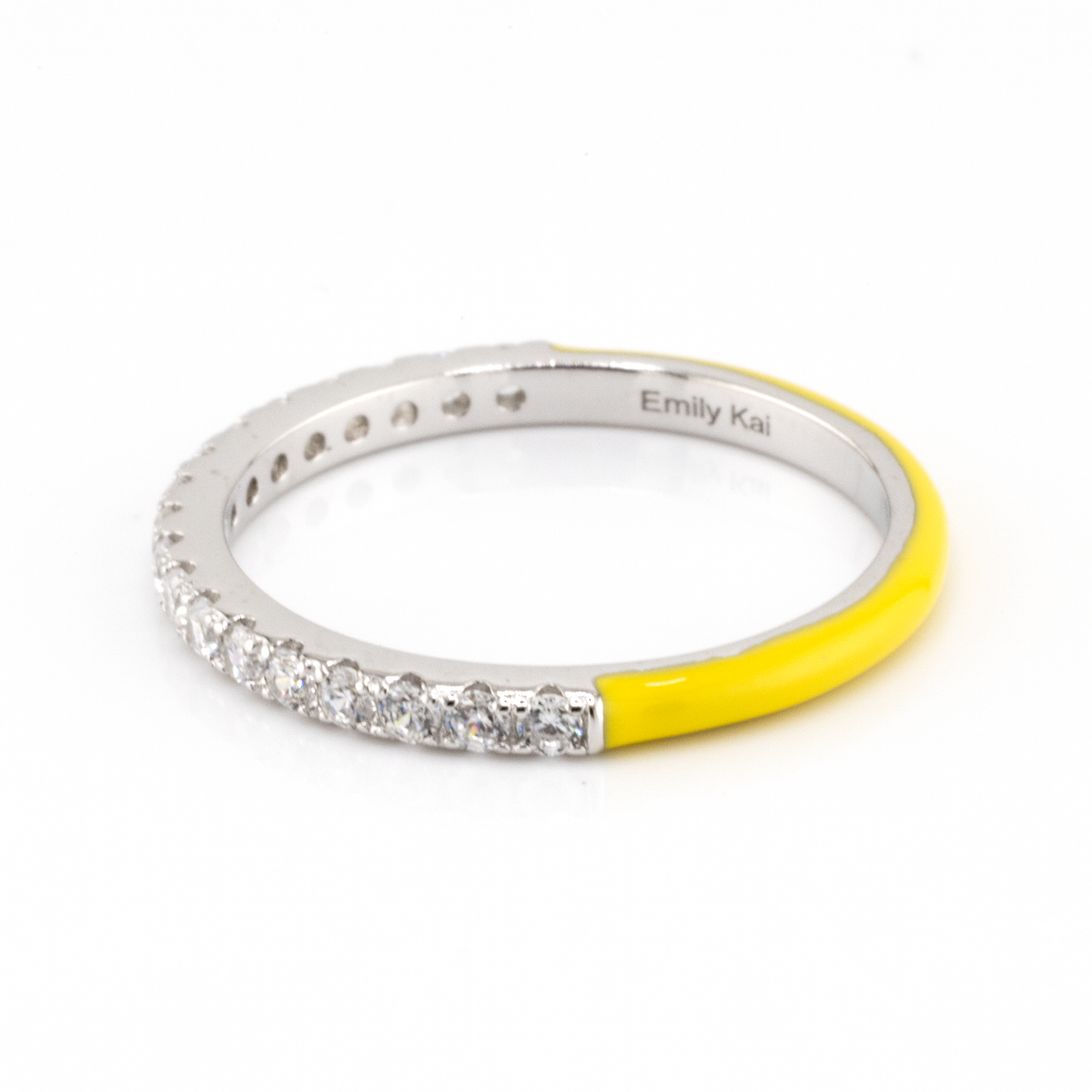 Silver ring with yellow accent and 'Emily Kai' engraving on a white background