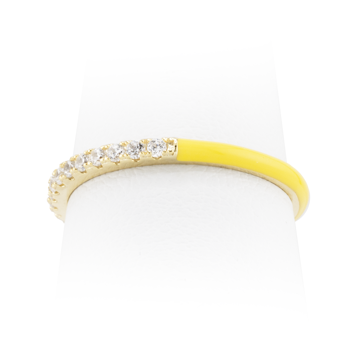 Ring with yellow band and diamond-studded gold band on a white background
