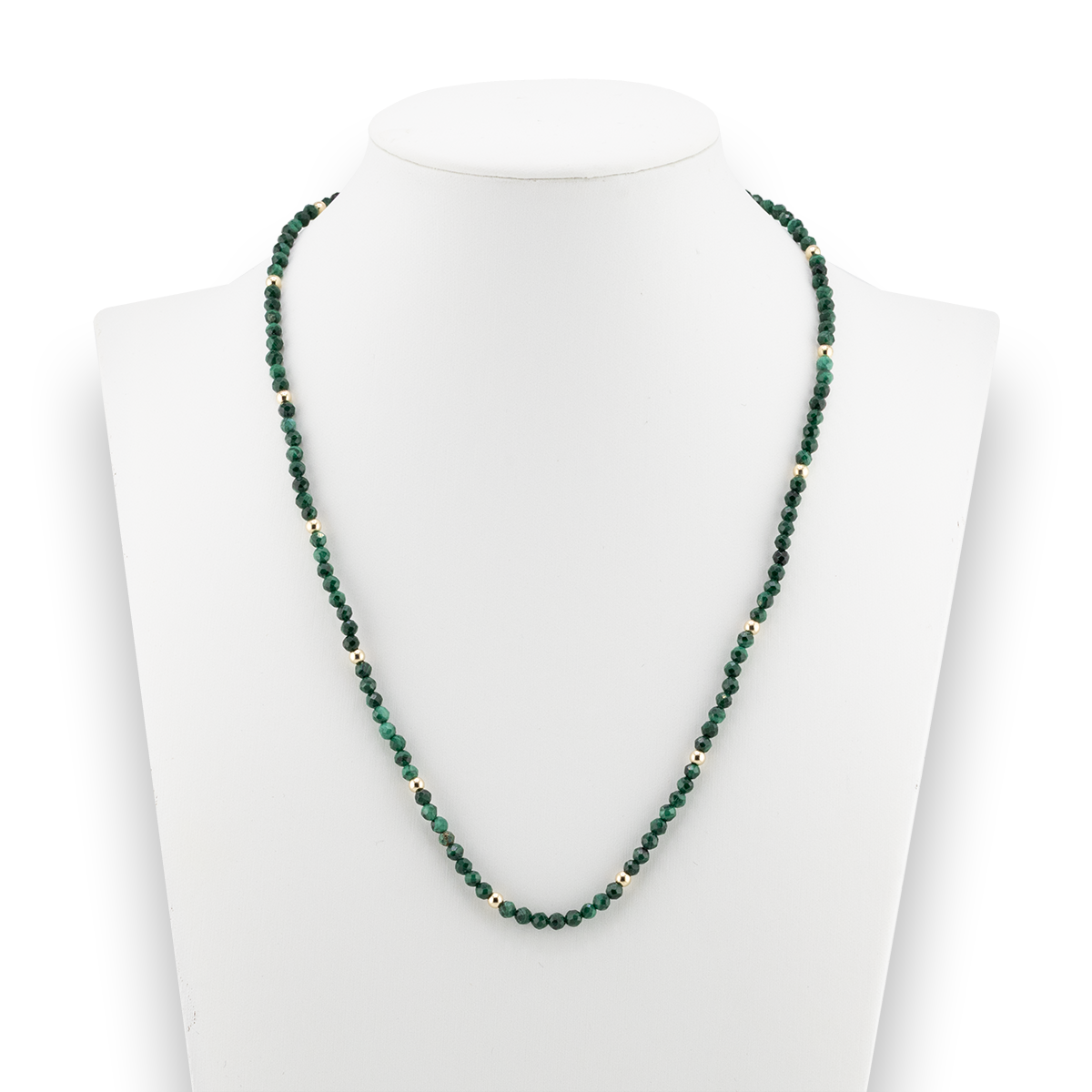 Green beaded necklace on a mannequin with a white background