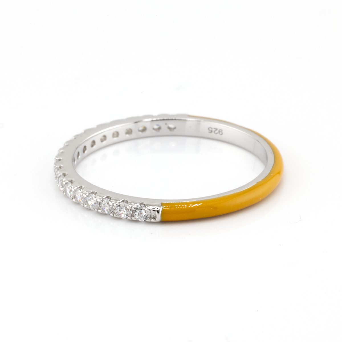 Silver ring with yellow accent on a white background