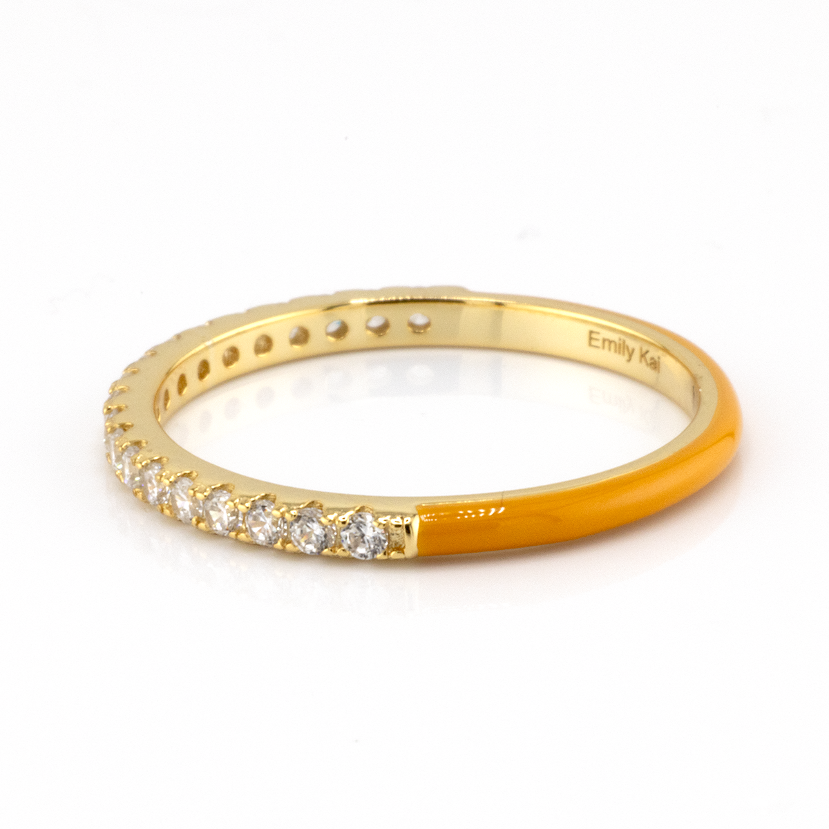 Gold ring with diamonds on a white background