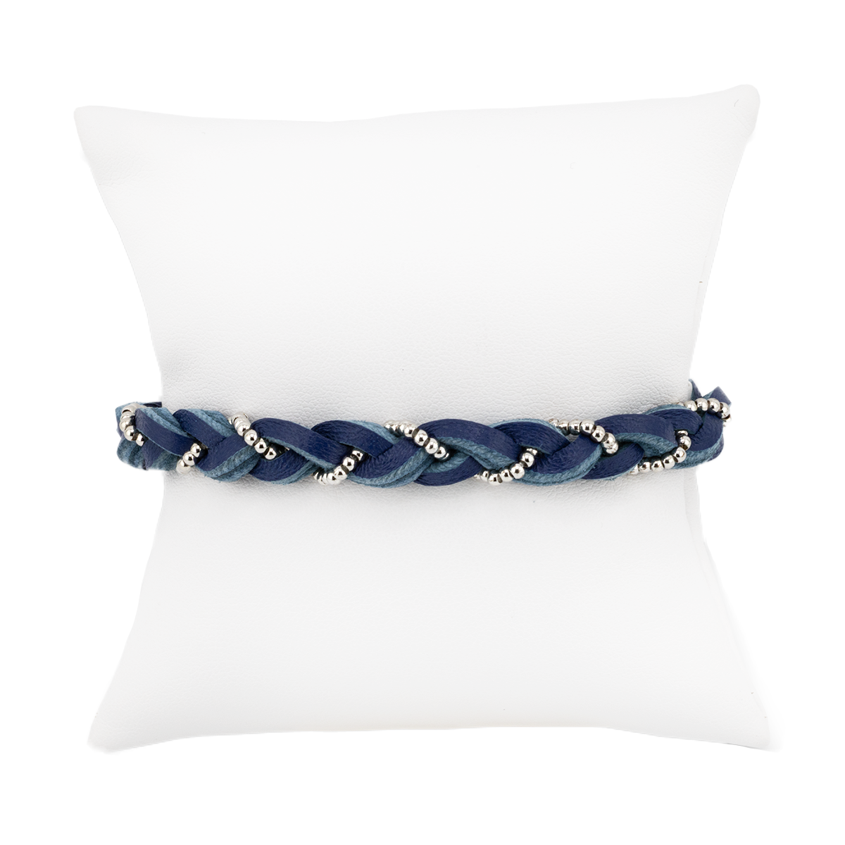 Blue braided bracelet with beads on a white pillow