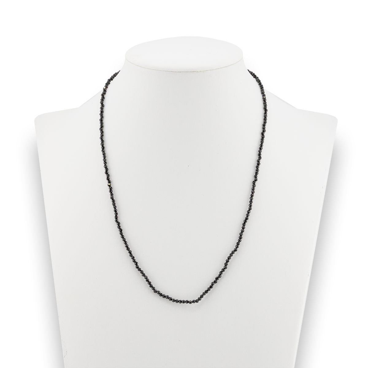 Black beaded necklace on a white mannequin bust