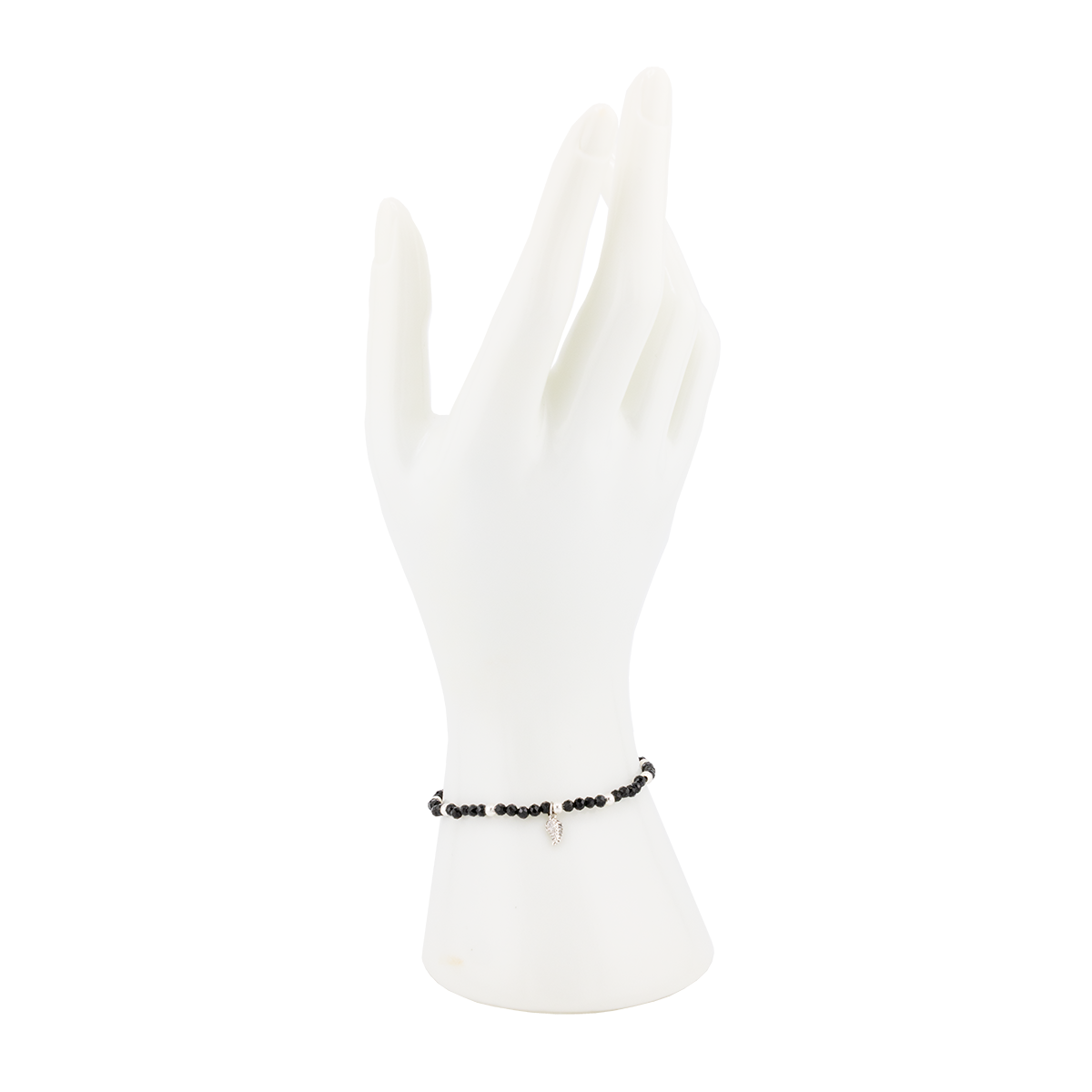 Black beaded bracelet on a white mannequin hand with a white background