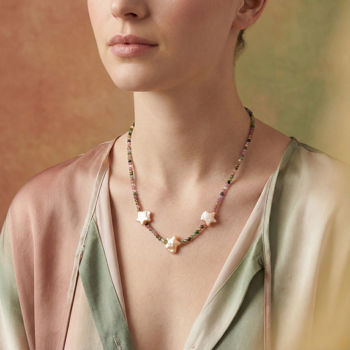 Woman wearing a delicate necklace with a soft background