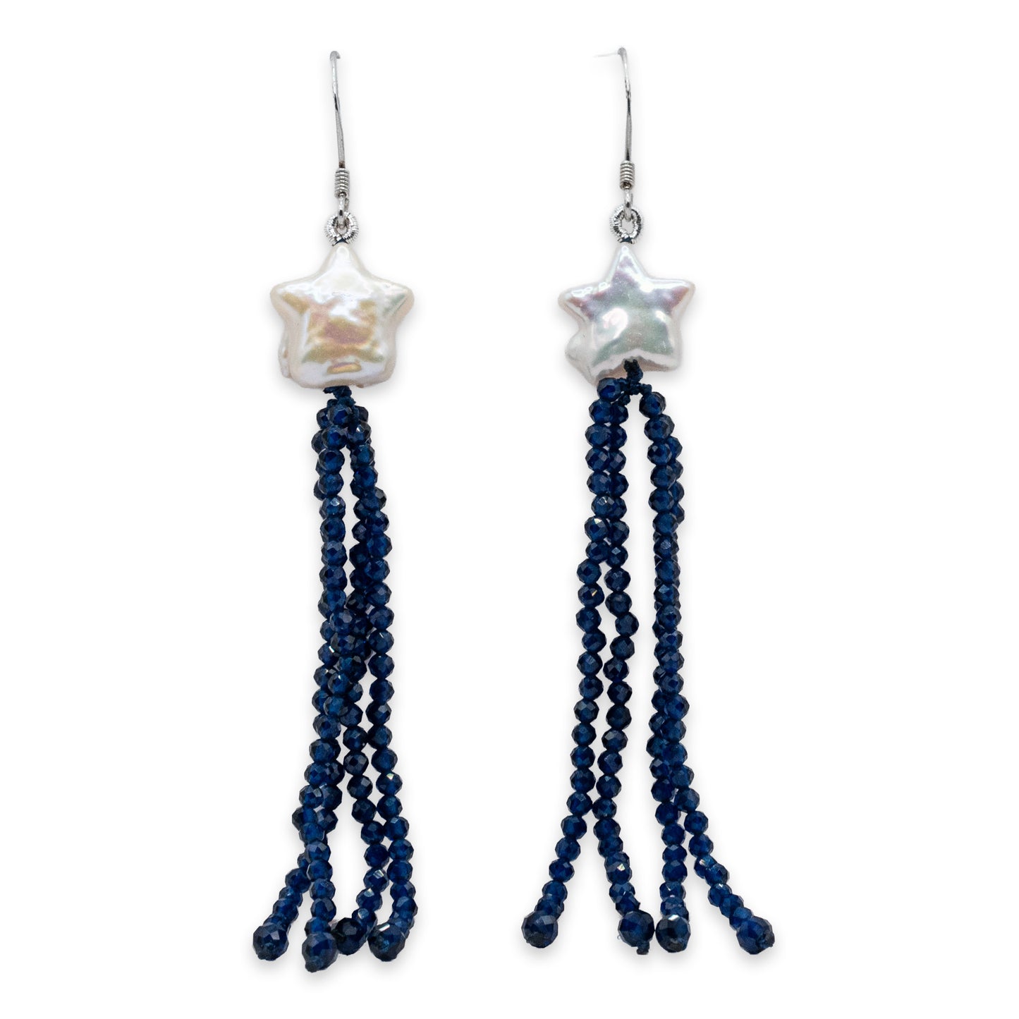 Pair of earrings with star-shaped beads and blue beaded tassels on a white background