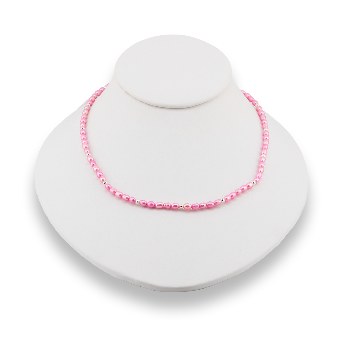 Pink beaded necklace on a white stand with a white background