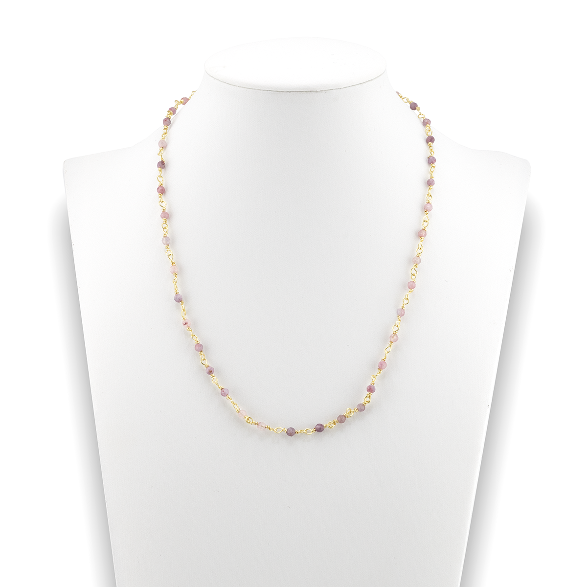 Necklace with multicolored beads on a white mannequin