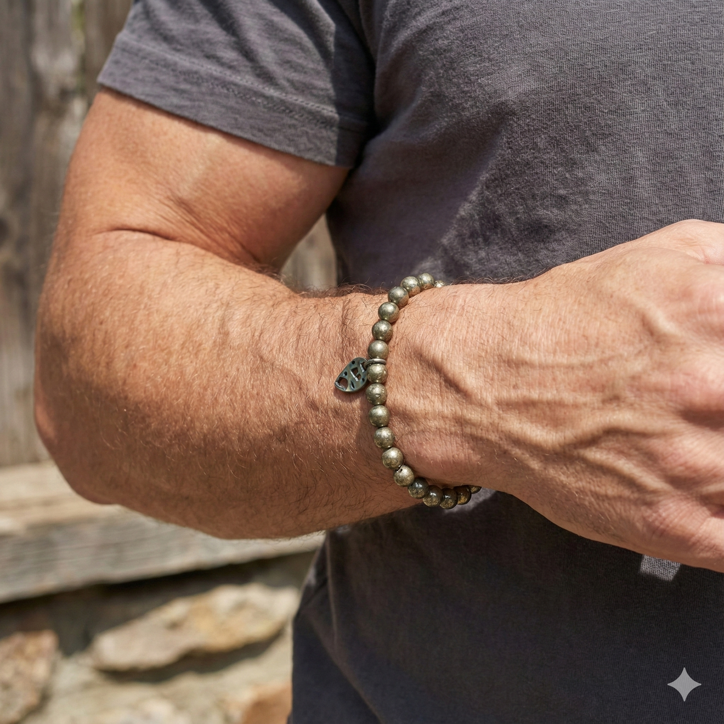 Person wearing a beaded bracelet on an arm with a natural background