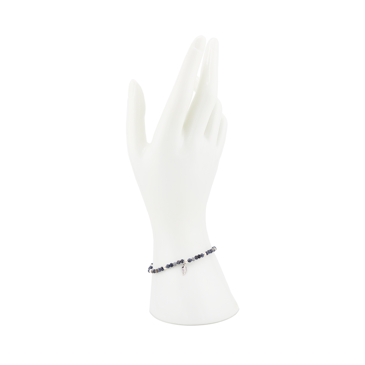 Bracelet on a white mannequin arm with a white background